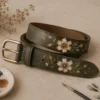 Luxury hand painted leather accessory with elegant floral artwork