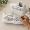 Luxury botanical leather sneakers with elegant floral artwork